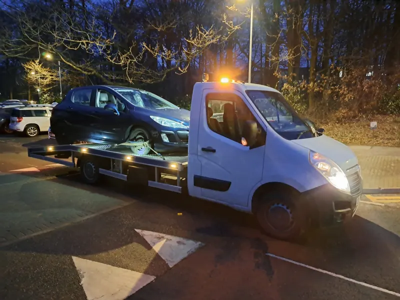 Non-running car collected at night near Kendal